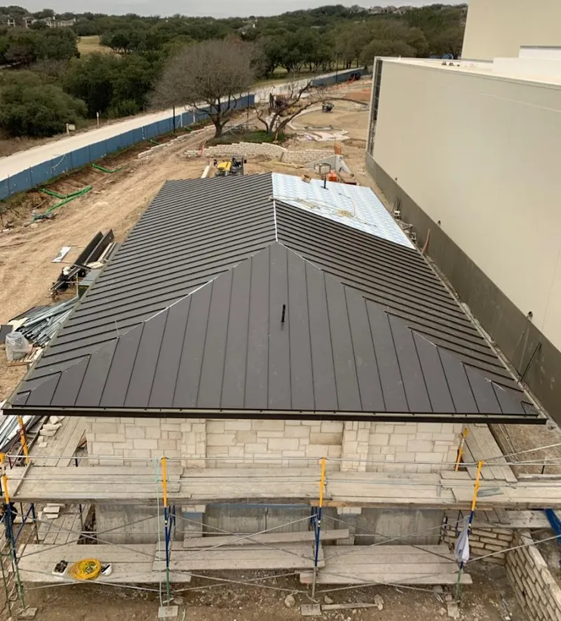 Metal roof new construction with scaffolding in Clayton